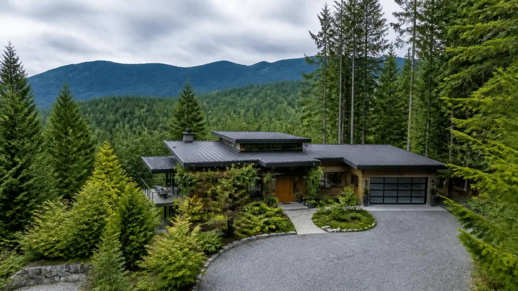 Contemporary mountain house surrounded by trees