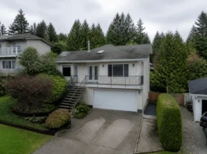 Suburban home with driveway and trees