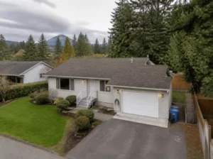 White split-level house with lawn
