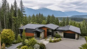 Modern home overlooking forest mountains