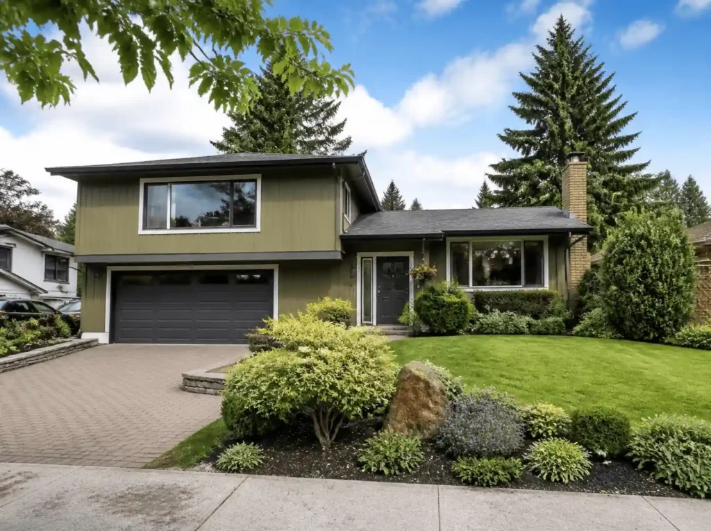 Burnaby home with green lawn and garage