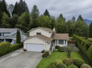 White suburban home with greenery